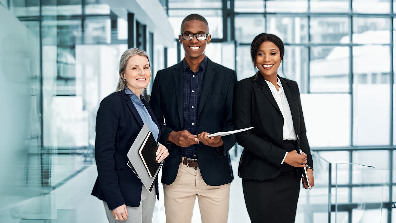 Diverse portrait of businesspeople working together in a modern office.