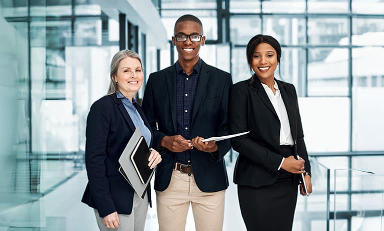 Diverse portrait of businesspeople working together in a modern office.