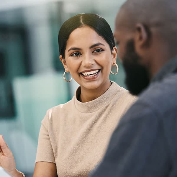 Shot of a businesswoman having a meeting with her colleague while using a digital tablet.